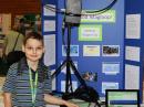 Dragan Tuip, KG7OQT, with his magnetic loop antenna at the Washington State Science and Engineering Fair. [Mike Bay/WSSEF photo]